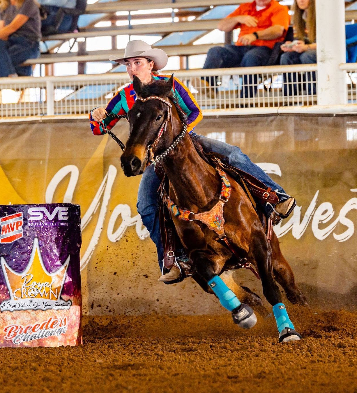 Lacey rounding a barrel on her horse in competition